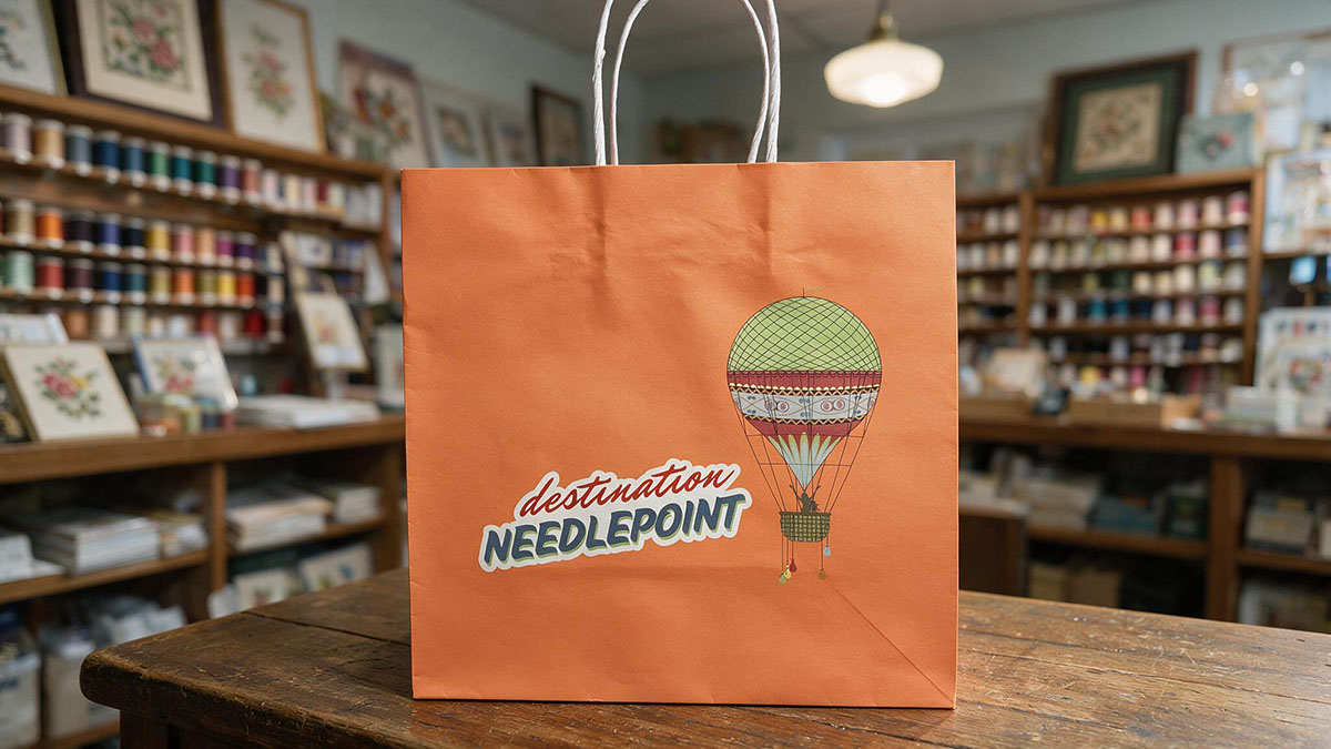 Destination Needlepoint Custom Midtown Paper Shopper on the Counter